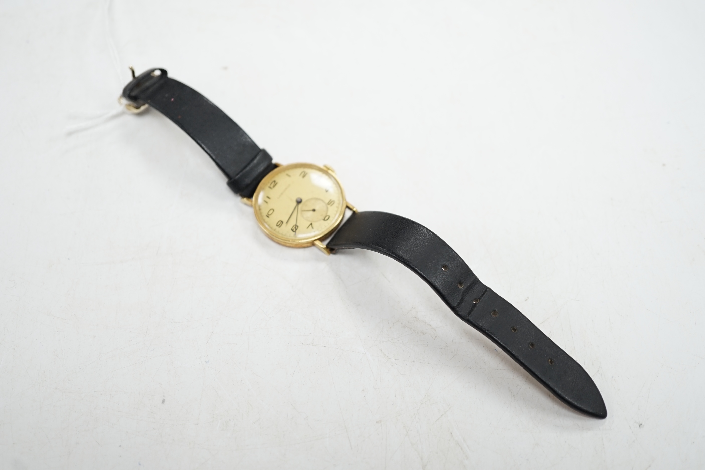 A Longines gentleman's 18ct gold wrist watch, with subsidiary seconds. Condition - appears to run, gauging to side, otherwise fair